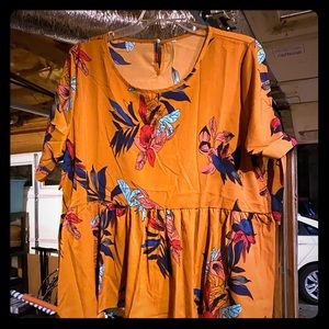 Peplum blouse with tie sleeves.